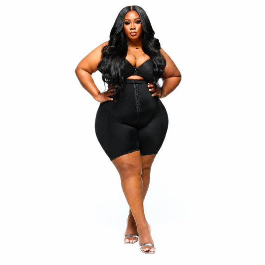 Plus-size model wearing the Karla Tobie Sculpting Shapewear Bodysuit in black against a white background.